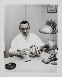 Technician working on dentures in the Mikesell Dental Laboratory at 600 B Street, Santa Rosa, California, 1962