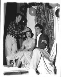 Bob Rodakowski crowns Virginia Albertoni queen of St. Vincent's High School Mardi Gras dance and Allen D'Ambrogi as king, Petaluma, California, 1955