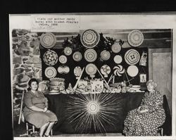 Elsie Allen and Annie Burke with Pomo basket display