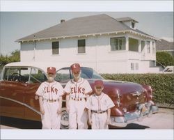 Three boys wearing Elks Little League baseball uniforms, Petaluma, California, 1958