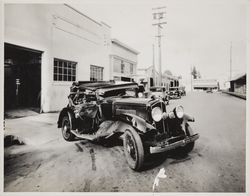 Damaged automobile outside a garage on Main Street, Sebastopol