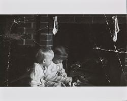 Bonnie and Bill Alwes in front of a fireplace, Santa Rosa, California, Christmas, 1949