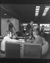 Shamus O'Grady interviewing Harold Trebbe at grand opening of Bank of Sonoma County., Santa Rosa, California, March 19, 1973