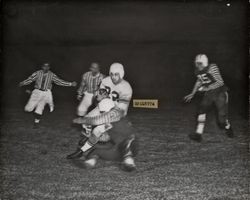 Run play during Petaluma Leghorn game against South San Francisco Windbreakers