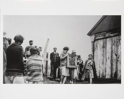 Women holding a Madonna icon at a Fort Ross ceremony