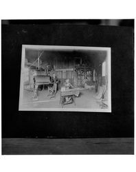 Two men working in an unidentified barn-like shop, Petaluma, California, 1915