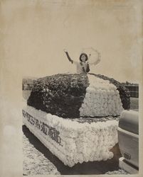 Dairy Princess, Nancy Corda, riding on a parade float at the Sonoma County Fair, Santa Rosa, California