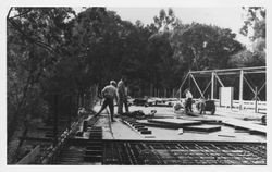 Workers constructing unidentified bridge