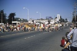 Analy Nursery School students and parents in the Sebastopol Apple Blossom Parade with Analy Theater in background, April 10, 1971