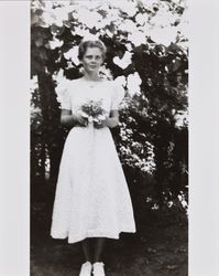 Mary McGregor holding a bouquet of flowers, Santa Rosa, California, about 1936