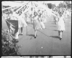 Marching units of women and girls in the Rose Parade