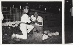 4H Club teen with rabbits at the Sonoma County Fair, Santa Rosa, California, 1986