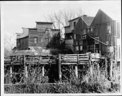 Warehouse buildings along the Petaluma River above Washington Street bridge in Petaluma, California, 1967