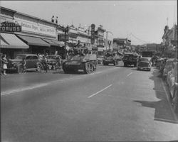 Tanks rolling up Main Street to advertise a World War II bond drive, Petaluma, California, about 1944