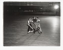 Two male skaters spinning two female skaters aloft in the Skating Revue of 1957, Santa Rosa, California, April, 1957