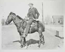 Unidentified man on a horse