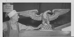 Lucien Pedeprade looks over the golden image of an eagle, Petaluma, California, about 1955