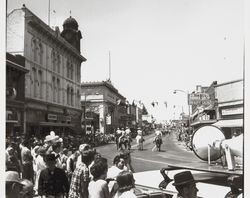 Group of men riding horses marches in the Sonoma-Marin Parade, Petaluma, California, 1950s