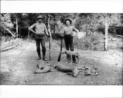 Frank Trosper and Hamilton Otis stand beside three dead deer, Cazadero, California, about 1900