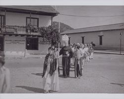 Fr. Alfred Boeddeker OFM leads "Indian Maidens" at the Valley of the Moon Festival, 453 First Street East, Sonoma, California, 1950