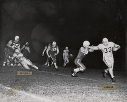 Run play during Petaluma Leghorn game against South San Francisco Windbreakers