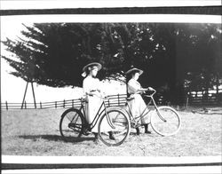 Two girls with bicycles, Petaluma, California, about 1900