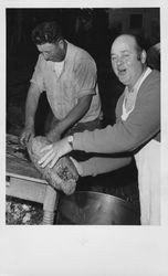 Leo Lavio and Elmo Garzelli preparing the barbecue for the Old Adobe Fiesta, Petaluma, California, 1962