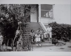 Children of Fred L. and Georgiana Volkerts sit on the front steps of the Volkerts home, Petaluma, California, July 1938