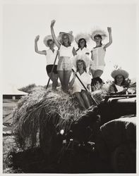 Fair models on a tractor at the Sonoma County Fair, Santa Rosa, California, about 1951