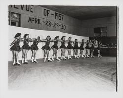 Line of skaters linking arms in the Skating Revue of 1957, Santa Rosa, California, April, 1957