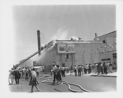 Extinguishing the fire at the California Theatre, Petaluma, California, 1957