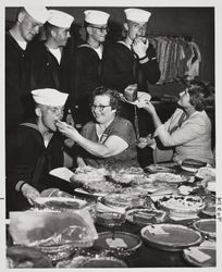 Pies and cakes from the domestic arts exhibit are appreciated by Coast Guard members at the Sonoma County Fair, Santa Rosa, California, July 21, 1958