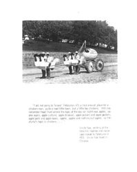 Four boys dressed like chickens pulling an egg float on Main Street near Hill Plaza Park in Petaluma, California, about 1923