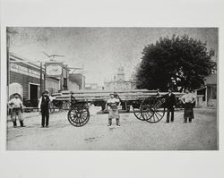 Carriage makers at Baker & Ross displaying a specially made wagon