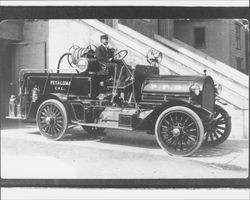 Tony Peters at the wheel of fire engine, Petaluma, California, 1913