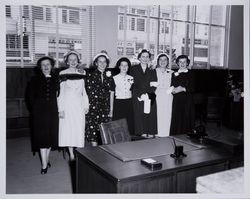 Women posing for a photograph in the American Trust Company offices