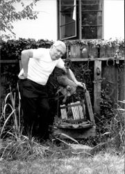 Ed Mannion posing beside an old piece of equipment, Petaluma, California, September, 1987