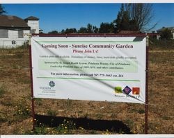 Sunrise Community Garden Sign with the Hansen House in the background, Sunrise Parkway, Petaluma, California, September 16, 2010