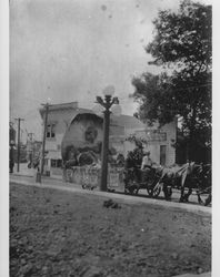 Floats being driven down East Washington Street near the intersection of Copeland Street, Petaluma, California, about 1920