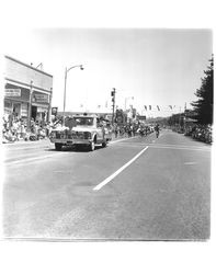 Car in 1967 parade in Petaluma, California with banner reading, "Here come the Girl Scouts"--a unit in the Sonoma-Marin Fair Parade