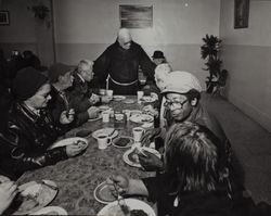 Fr. Boeddeker greeting guests at St. Anthony's Dining Room, 121 Golden Gate Avenue, San Francisco, California, February 1979