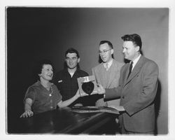 Cathleen J. Hunt receiving a heart collection container, Petaluma, California, 1955