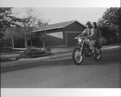 Unidentified people on motorcycles in Petaluma, California, 1973