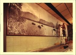 Working on the mural at the Ice Arena