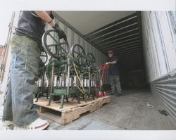 Tim Rhodes and Russell Strickland move a braiding machine into the truck for shipping to Kansas, Sunset Line & Twine Company in Petaluma, California, Dec. 2006