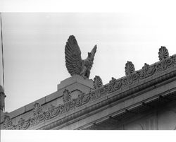 Terra cotta eagles and decoration at the top of Wells Fargo Bank