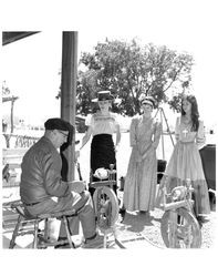 Mannion girls watching a spinner at Old Adobe Fiesta, Petaluma, California, about 1965