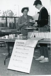 Gaye LeBaron purchasing a book at the Friends of the Library book sale