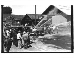 Group of people with Two Rock fire truck, Two Rock, California, about 1950