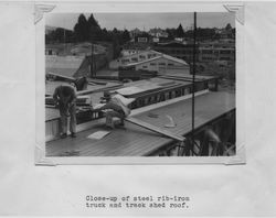 Close-up of the truck and train shed roof at the Poultry Producers of Central California feed mill, Petaluma, California, 1938